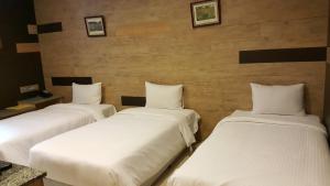 Letto o letti in una camera di Empire Hotel