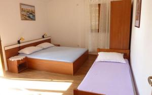 Posteľ alebo postele v izbe v ubytovaní Studio Apartments Izabela