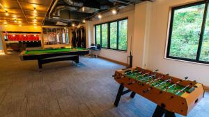 a billiard room with a pool table and a pool table at Motosu Phoenix Hotel in Fujikawaguchiko