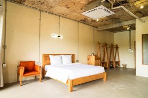 Giường trong phòng chung tại WoCAL Retreat Ke Ga