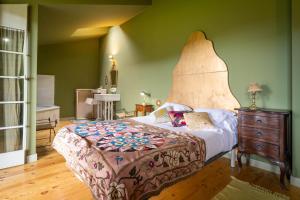Postel nebo postele na pokoji v ubytování Hotel Alma de Romero
