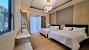 Ένα ή περισσότερα κρεβάτια σε δωμάτιο στο The Lux 5BR Villa Vimala Hills