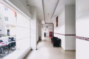 a hallway of a building with a motorcycle parked in it at RedDoorz at STM Suite Medan Amplas in Medan +17 photos