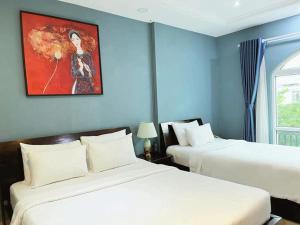 Postel nebo postele na pokoji v ubytování La Serena Hotel & Apartment