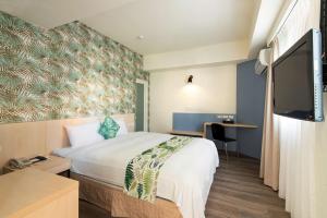 Postel nebo postele na pokoji v ubytování Liga Hotel