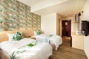 Postel nebo postele na pokoji v ubytování Liga Hotel