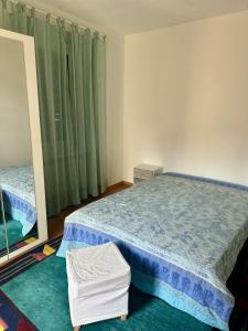 Ένα ή περισσότερα κρεβάτια σε δωμάτιο στο Appartamento Tre Torri - in pieno centro città