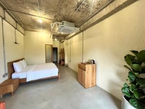 Giường trong phòng chung tại WoCAL Retreat Ke Ga