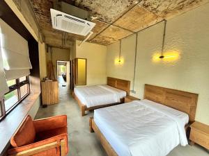 Giường trong phòng chung tại WoCAL Retreat Ke Ga