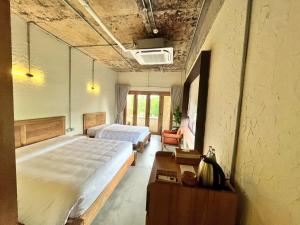 Giường trong phòng chung tại WoCAL Retreat Ke Ga