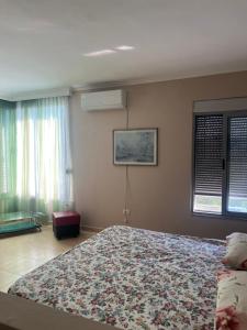 Giường trong phòng chung tại Lena's Guesthouse +1 ảnh