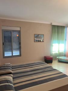 Giường trong phòng chung tại Lena's Guesthouse