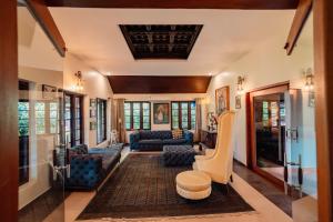 a living room with couches and chairs in a house at Madilina Heritage Villa in Parūr +57 photos