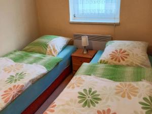 Postel nebo postele na pokoji v ubytování Ferienwohnung Elfi