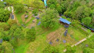 an overhead view of a yard with a house and trees at Borneo Happy Farm in Kuching