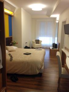 Un televizor și/sau centru de divertisment la Hotel Desiderio