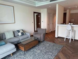 a living room with a couch and a table at gewan island in Doha