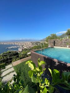 a swimming pool on the roof of a house at Relais Manfredi in Castellammare di Stabia