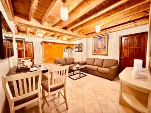 a living room with a couch and a table at Sangria-Luna Resort and Hotel in Luna