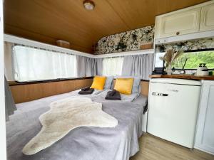 a bed in the back of a rv at Majakatare Holiday Homes in Maasi