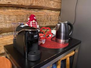 a counter with a coffee maker on top of it at Pirts Muzejs in Loja