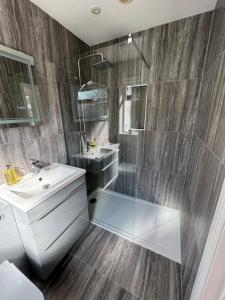 a bathroom with a sink and a shower at Home at Number 27 in Trowbridge +21 photos