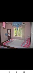 Postel nebo postele na pokoji v ubytování Deniyaya Guest House