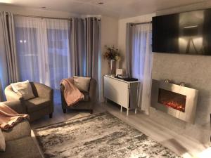 Khu vực ghế ngồi tại River Coquet Luxury Hot Tub Retreat