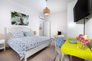 Ένα ή περισσότερα κρεβάτια σε δωμάτιο στο Verde Smeraldo-Pompei