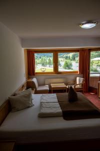 Postel nebo postele na pokoji v ubytování Alpine B&B