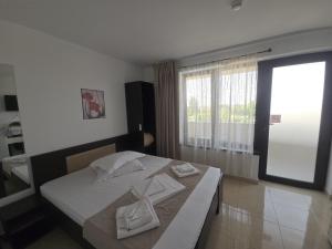 Postel nebo postele na pokoji v ubytování Complex Casa Ani