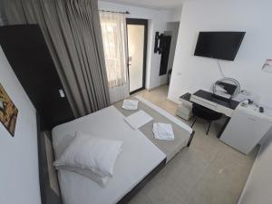 Postel nebo postele na pokoji v ubytování Complex Casa Ani