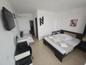 Postel nebo postele na pokoji v ubytování Complex Casa Ani