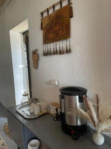 a kitchen counter with a mixer and a mirror at Nomad place - horse riding tour Son-Kul in Dzhangyaryk +24 photos