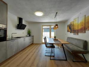a living room with a table and a couch at Haus Gstrein in Oetz