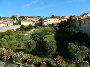 a view of a city with bushes and houses at Michelino in Florinas