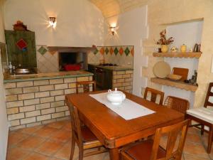 a kitchen with a wooden table with a bowl on it at Michelino in Florinas