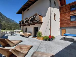 a patio with a ping pong table on a building at Haus Gstrein in Oetz +9 photos