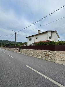 a building on the side of a road at Villa dos Amados in Viana do Castelo