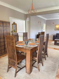 a dining room with a wooden table and chairs at Villa dos Amados in Viana do Castelo +56 photos