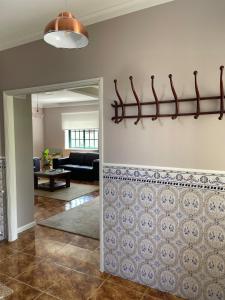 a living room with a wall with a tile at Villa dos Amados in Viana do Castelo