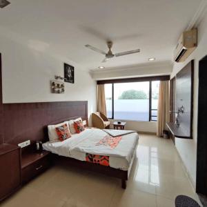 Postel nebo postele na pokoji v ubytování Hotel Shree Sai Wada