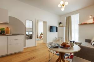 a living room with a couch and a table at homie stay Dominikus in Würzburg +67 photos