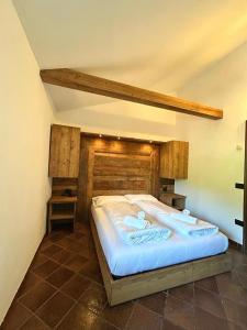a bedroom with a large bed in a room at La Vecchia Partenza in Piaggia +15 photos
