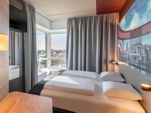 Postel nebo postele na pokoji v ubytování B&B HOTEL Aalborg