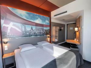 Postel nebo postele na pokoji v ubytování B&B HOTEL Aalborg