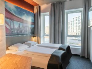 Postel nebo postele na pokoji v ubytování B&B HOTEL Aalborg