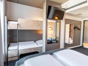 Postel nebo postele na pokoji v ubytování B&B HOTEL Aalborg