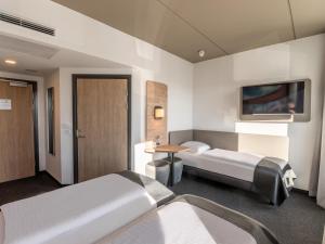 Postel nebo postele na pokoji v ubytování B&B HOTEL Aalborg