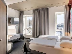 Postel nebo postele na pokoji v ubytování B&B HOTEL Aalborg